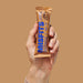 Misfits - Vegan Protein Bar Chocolate Cookie Dough held vertically in a hand