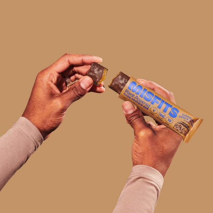 Misfits - Vegan Protein Bar Chocolate Cookie Dough 45g held in 2 hands