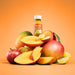 Plenish - Mango Sunshine Vitamin D Health Shot 60ml on a pile of cut mango