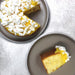 Lemon Drizzle Bento Cake - Bakerdays with a slice cut out