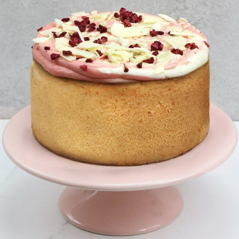 Raspberry Ripple Bento Cake - Bakerdays on a pink cake stand