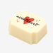 A white chocolate filled with dark chocolate ganache, made by Harry Specters, with a For my Sweetheart message printed on the top.