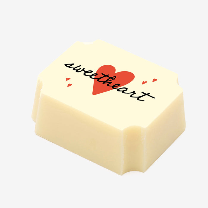 A white chocolate filled with dark chocolate ganache, made by Harry Specters, with a for my sweetheart message printed on the top