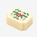 A white chocolate filled with dark chocolate ganache, made by Harry Specters, with a festive Christmas themed image printed on the top.